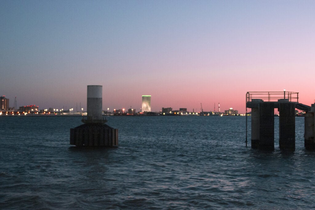 Purple and pink hues fill the sky in this Galveston sunset.