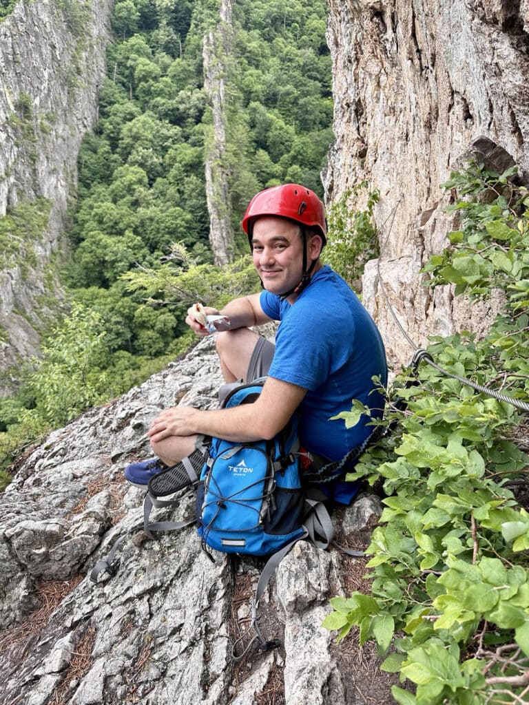 Climber taking a break during the Via Ferrata climb at NRocks in West Virginia