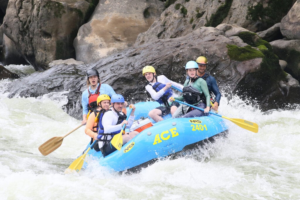 Family enjoying New River Gorge whitewater rafting adventure in West Virginia