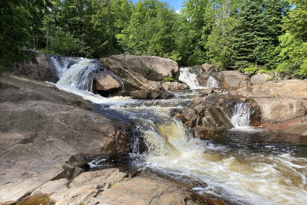 Ultimate Guide To Visiting Waterfalls In Marquette Michigan yellow dog waterfall