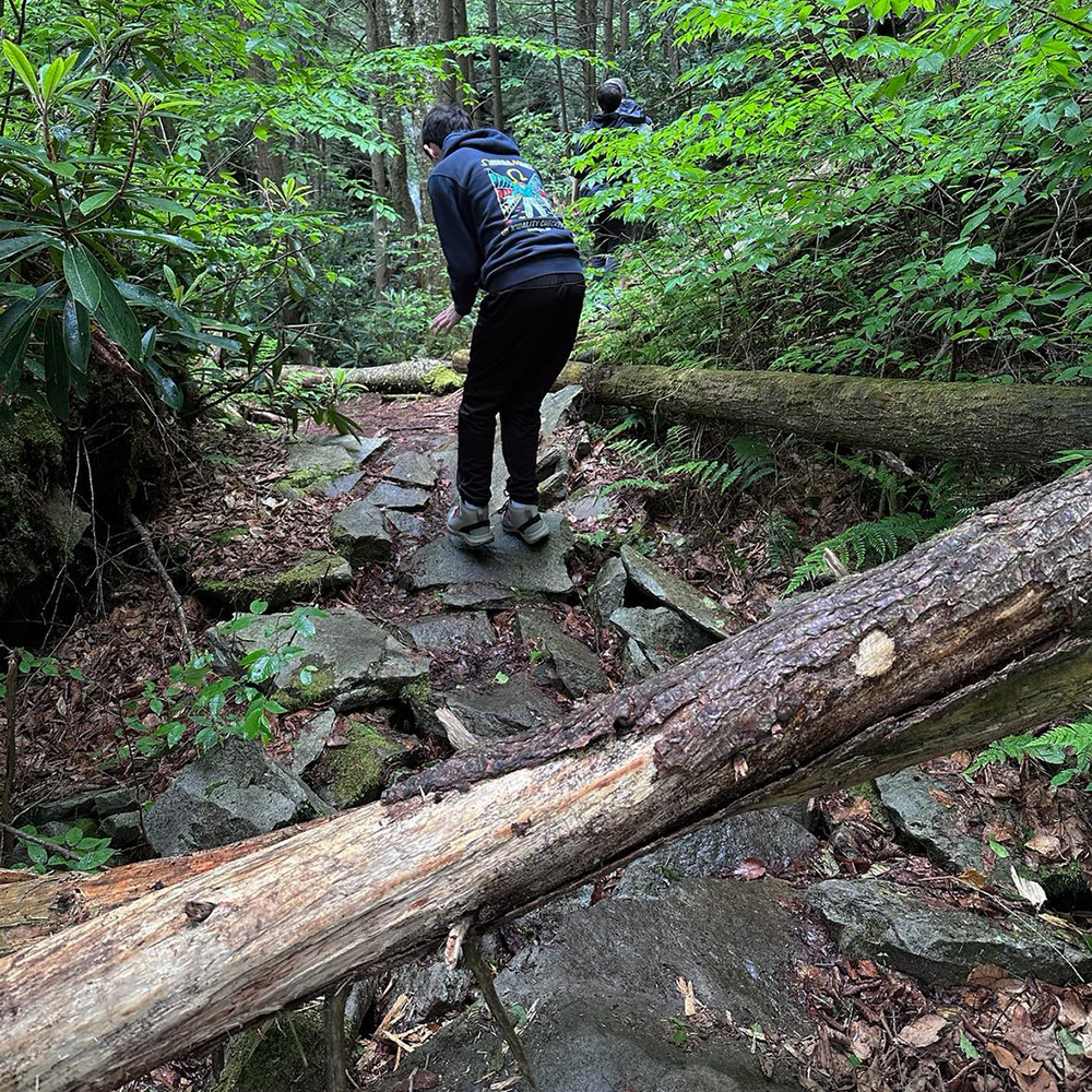 Making our way down to the base of Elakala Falls, navigating a rugged trail in Blackwater Falls State Park.